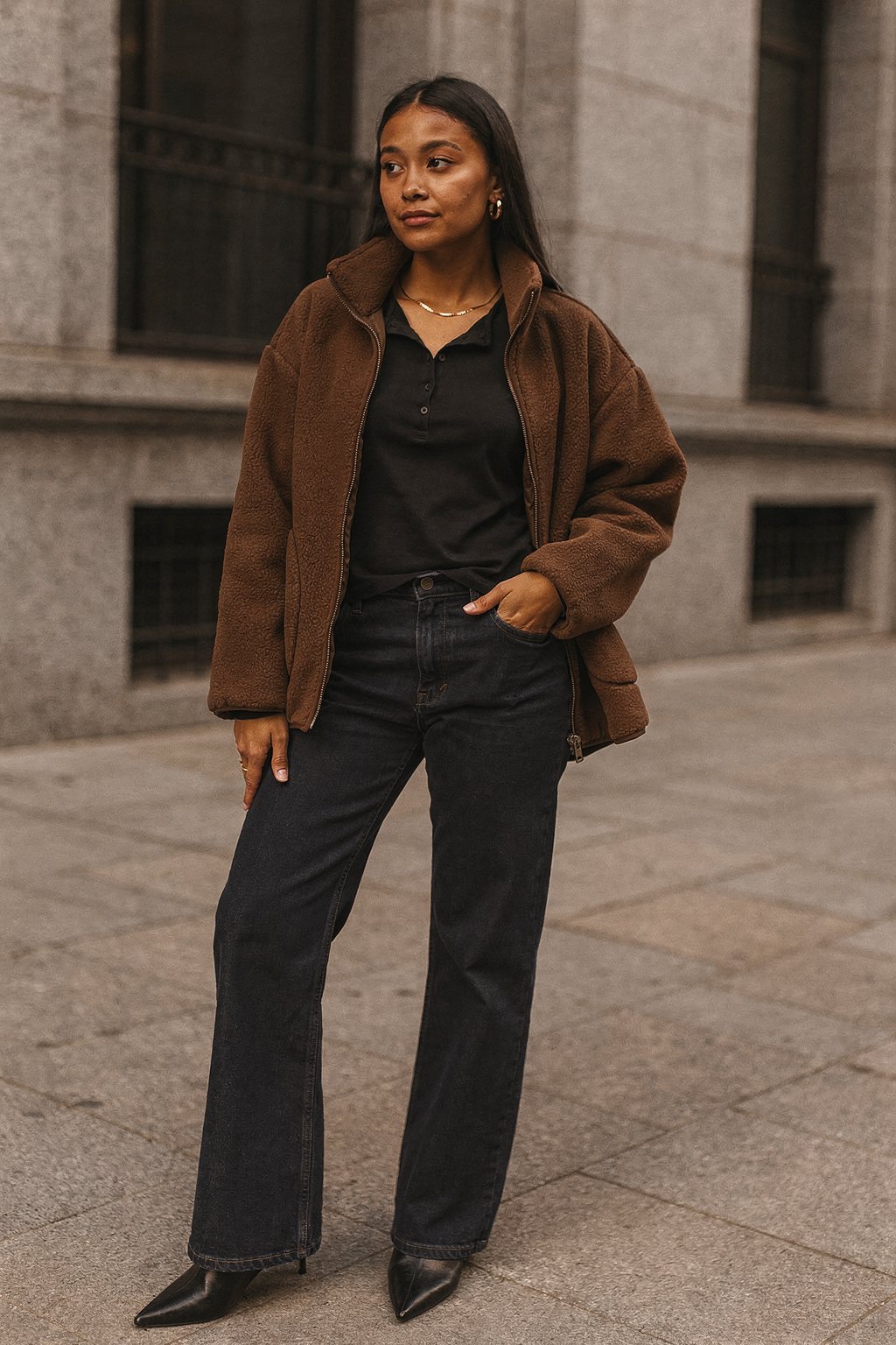 AI-generated outfit image: Office look for autumn with a brown jacket and loose jeans